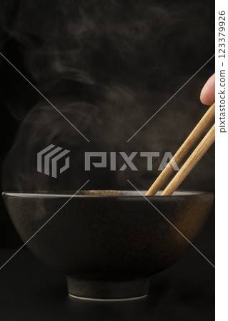 Steam rising from a teacup Steam rising from a teacup 123379926