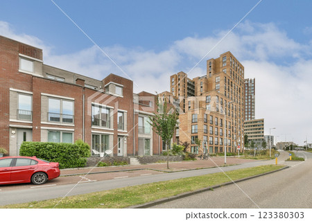 An illustration of modern urban architecture showcasing contemporary buildings and residential designs, set in a vibrant city environment. 123380303