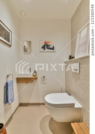 A sleek and contemporary bathroom featuring minimalist decor, clean lines, and neutral tones, focusing on simplicity and style. 123380549