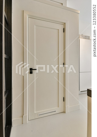 A sleek interior featuring white walls and a minimalist design. The clean lines and simplicity create a calming atmosphere, ideal for modern living. 123380552