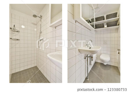 Contemporary bathroom featuring a well-arranged shower and sink area, designed with minimalistic white tiles and efficient use of space. 123380733