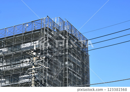 Yokohama cityscape in Japan - View of scaffolding and protective netting set up for repairs and inspections of apartment buildings (Yokohama city) Yokohama cityscape in Japan - View of scaffolding and protective netting set up for repairs and inspections of apartment buildings (Yokohama city) 123381568