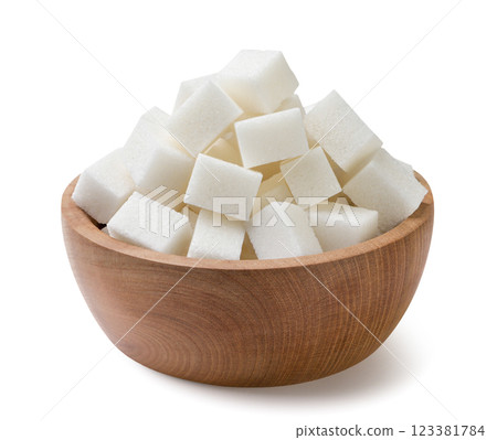 Heap of sugar cubes in wooden plate on a white background. Isolated 123381784