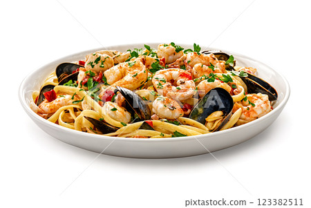 Delicious seafood pasta dish with shrimp and mussels garnished with parsley 123382511