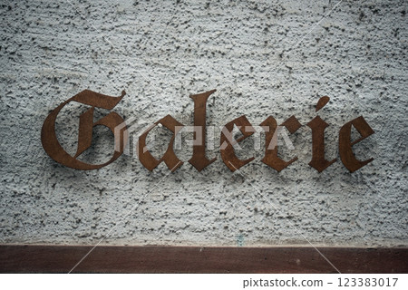 closeup of gallery signage on white wall in the street closeup of gallery signage on white wall in the street 123383017