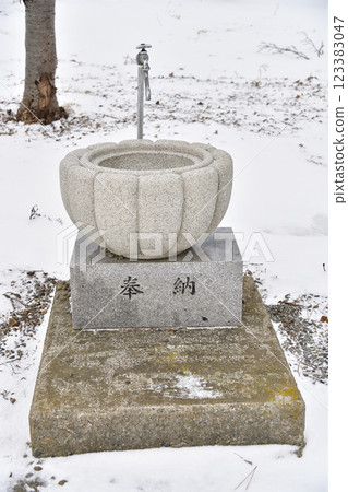 Photographing the grounds of Otomeyama Shrine in Kaminokuni, Hokkaido in winter 123383047
