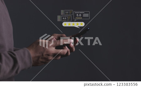 Young Man hand holding Smart Phone with five star to review and give 5 stars Young Man hand holding Smart Phone with five star to review and give 5 stars 123383556