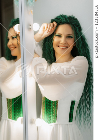 portrait of a bride with green curly hair in the beauty room portrait of a bride with green curly hair in the beauty room 123384316