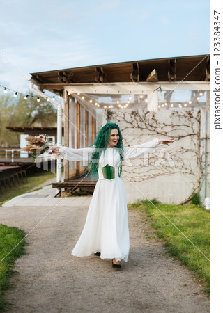 wedding ceremony of the newlyweds in a country cottage 123384347