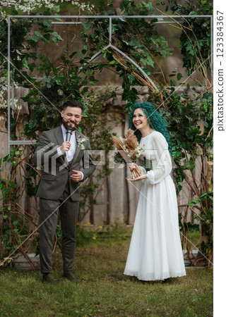 wedding ceremony of the newlyweds in a country cottage 123384367