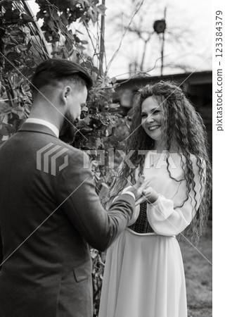 wedding ceremony of the newlyweds in a country cottage 123384379