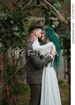 wedding ceremony of the newlyweds in a country cottage 123384387