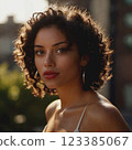 Young woman with dark short curly hair. Intent look. Girl in casual clothes. AI generated, with further retouching and processing in graphic programs 123385067