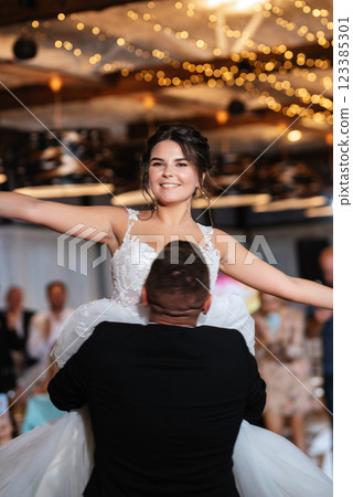 the first dance of the bride and groom inside a restaurant 123385301