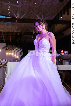 the first dance of the bride and groom inside a restaurant the first dance of the bride and groom inside a restaurant 123385318