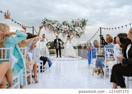wedding ceremony of the newlyweds on the pier 123385370