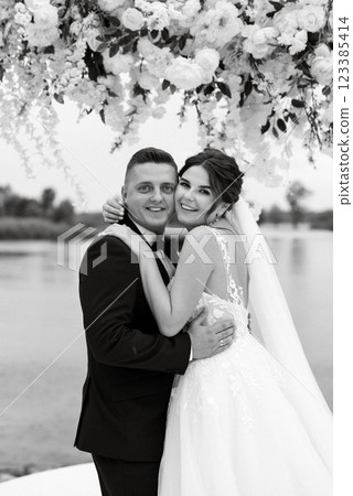 wedding ceremony of the newlyweds on the pier 123385414