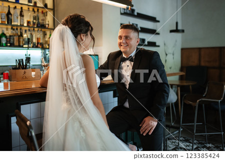 bride and groom inside a cocktail bar 123385424