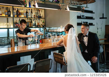 bride and groom inside a cocktail bar bride and groom inside a cocktail bar 123385426
