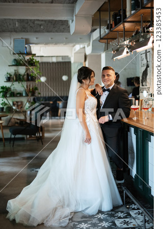 bride and groom inside a cocktail bar bride and groom inside a cocktail bar 123385453