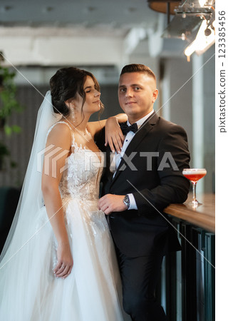 bride and groom inside a cocktail bar 123385456