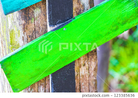 Colorful green plain beach directional arrows on Ilha Grande Brazil. Colorful green plain beach directional arrows on Ilha Grande Brazil. 123385636