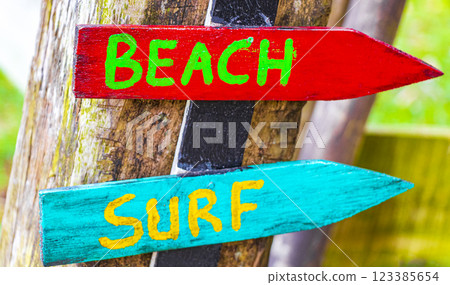 Sand beach surf relax colorful directional arrows Ilha Grande Brazil. 123385654