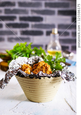 Delicious fresh crispy chicken nuggets on light background. Delicious fresh crispy chicken nuggets on light background. 123386175