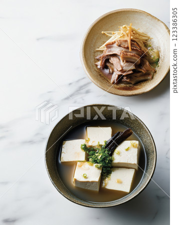 Japanese tofu soup with mushrooms and dashi broth Japanese tofu soup with mushrooms and dashi broth 123386305