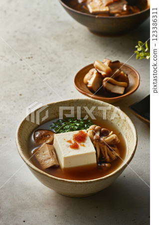 Japanese tofu and mushroom soup with roe Japanese tofu and mushroom soup with roe 123386311