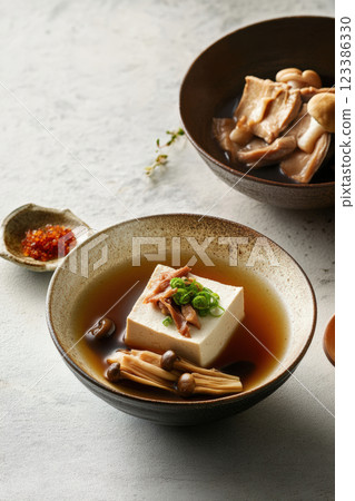 Japanese tofu soup with mushrooms and broth Japanese tofu soup with mushrooms and broth 123386330