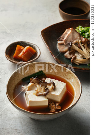 Tofu and mushroom soup in savory broth 123386332