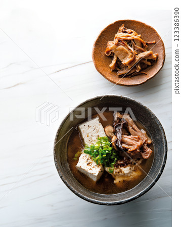 Tofu and mushroom soup in rustic bowl 123386390