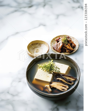 Japanese tofu and mushroom soup in dark broth Japanese tofu and mushroom soup in dark broth 123386394