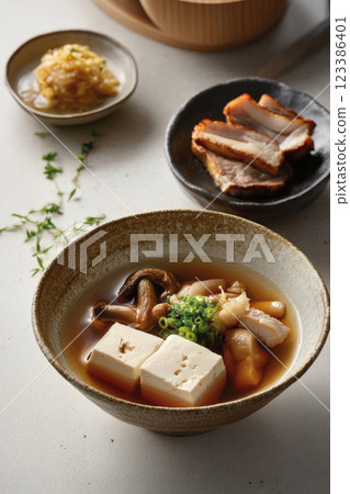 Japanese tofu soup with mushrooms and soy broth Japanese tofu soup with mushrooms and soy broth 123386401