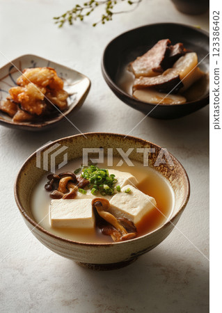 Japanese tofu soup with mushrooms and miso broth Japanese tofu soup with mushrooms and miso broth 123386402