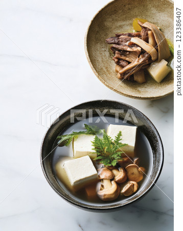 Japanese tofu soup with mushrooms and herbs Japanese tofu soup with mushrooms and herbs 123386407