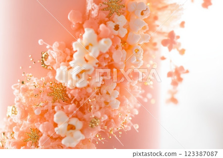 Elegant pink cake with gold popcorn decorations 123387087