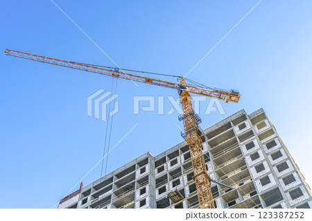 Construction of modern apartments. Construction site with cranes background 123387252