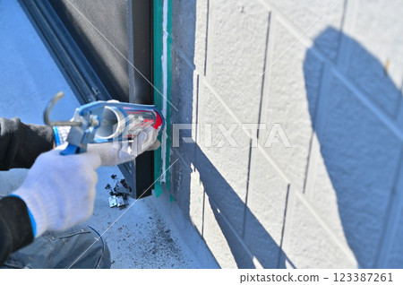 Caulking replacement and exterior wall painting work Caulking replacement and exterior wall painting work 123387261