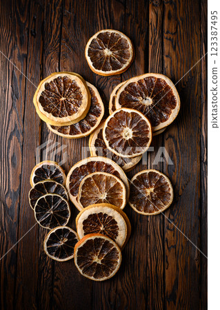 Dried citrus slices on rustic wooden table 123387495