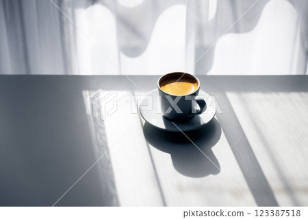 Morning espresso coffee by the window with natural light Morning espresso coffee by the window with natural light 123387518