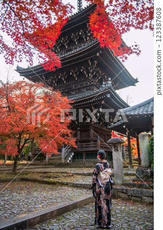 woman in Kimono view Shinnyodo pagoda by fall maple leaves, Kyoto woman in Kimono view Shinnyodo pagoda by fall maple leaves, Kyoto 123387608