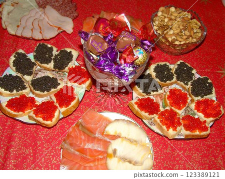 Red and black caviar over red background 123389121