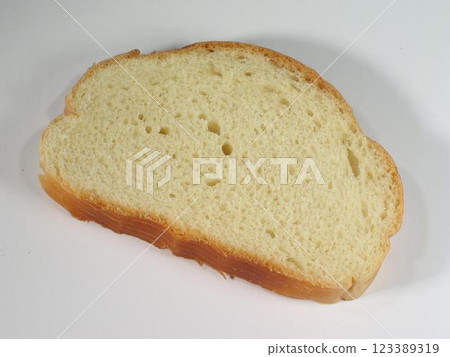 Piece of bread on the table close view background 123389319
