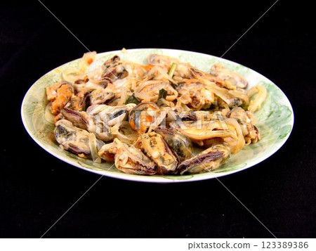 Seafood dishes on white plates Seafood dishes on white plates 123389386