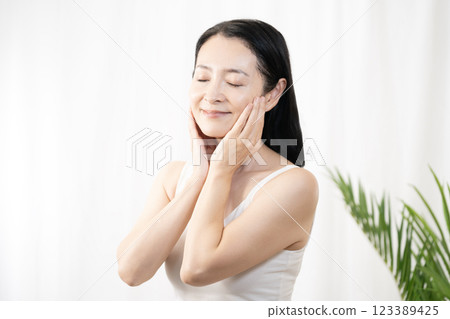 Woman doing skin care Woman doing skin care 123389425