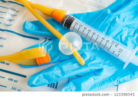 Foley catheter and urine drainage bag collect urine for disability or patient in hospital. Foley catheter and urine drainage bag collect urine for disability or patient in hospital. 123390543