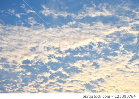 cloud spreading on bright sky in sunny day 123390764