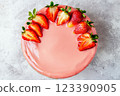 Pink glazed cake with fresh strawberry topping 123390905